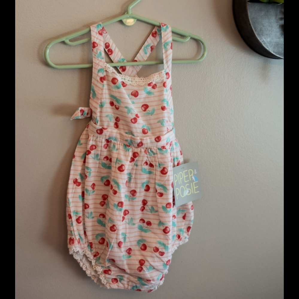 Piper and Posie pink and white stripe cherry print romper with lace detail